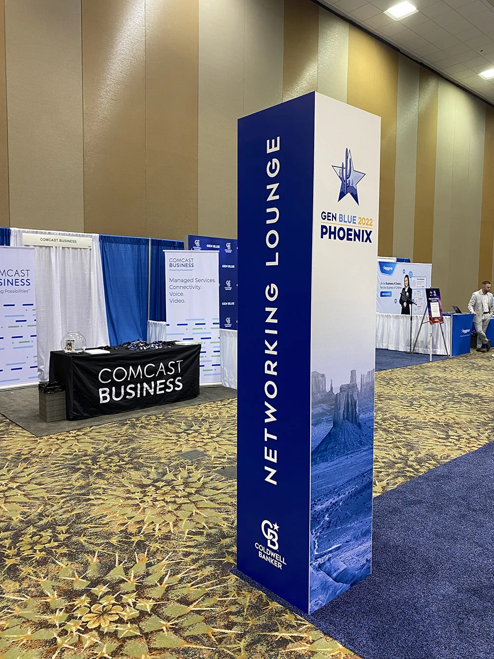 Gen Blue 2022 Phoenix networking lounge tower signage on the conference floor